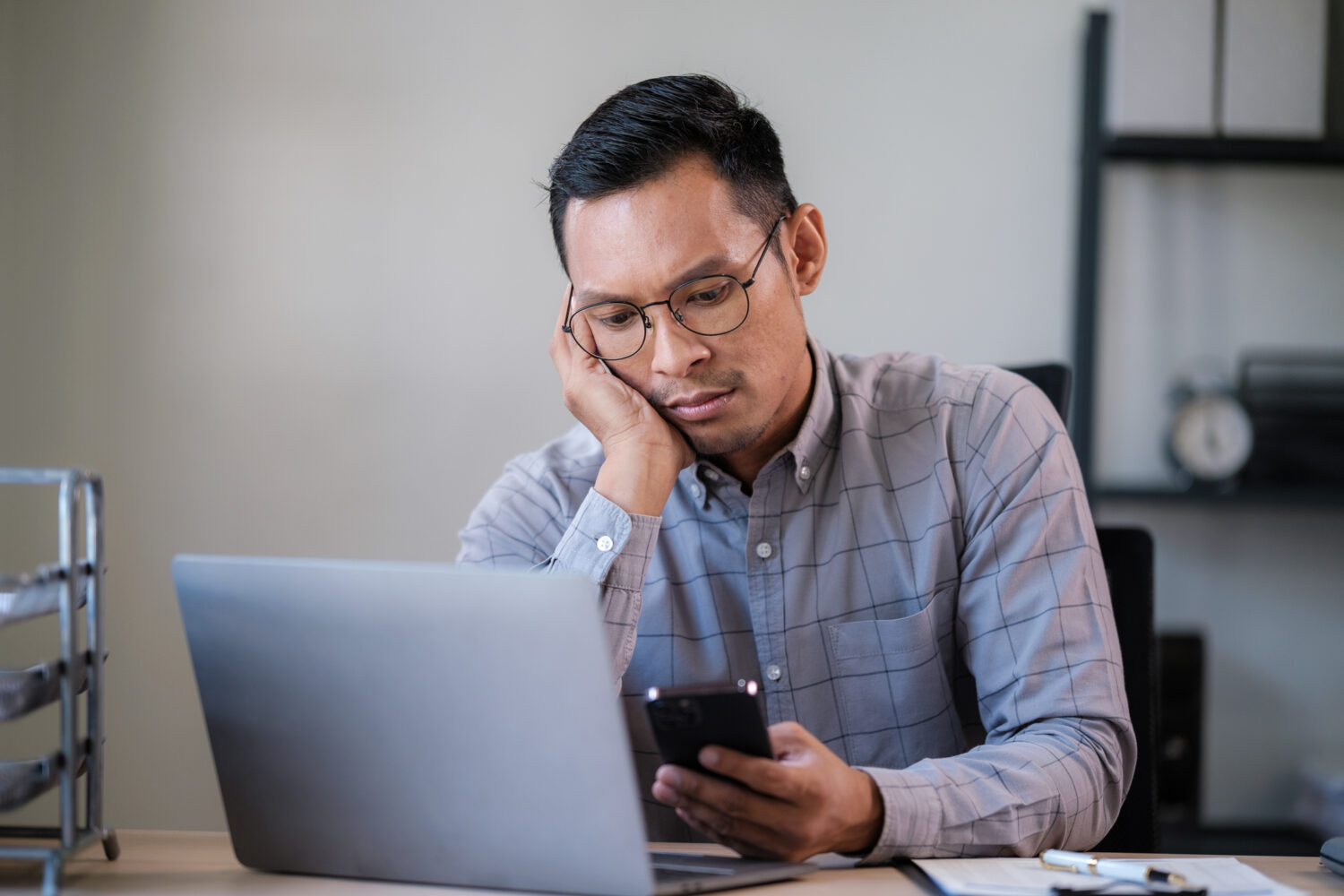 Distracted man trying to work